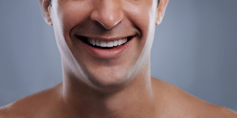Image showing Man, mouth and smile with skincare and lips with hygiene, jawline and satisfaction with treatment closeup. Grooming, confidence and cropped with male model in studio background for cosmetics