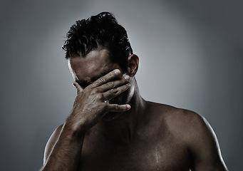 Image showing Man, hand and face hiding in studio for embarrassed shame on grey background or topless, unhappy or mockup space. Male person, model and fingers for bad decision or fail mistake, palm or distress