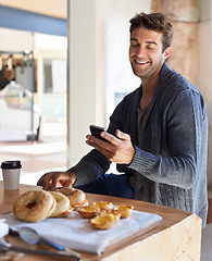 Image showing Phone, smile and man with breakfast at restaurant networking on social media, mobile app or internet. Happy, food and young male person scroll on cellphone with healthy meal at cafe or coffee shop.