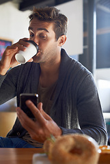 Image showing Phone, drinking and man with coffee at restaurant networking on social media, mobile app or internet. Research, technology and young male person reading on cellphone with cappuccino at cafe.
