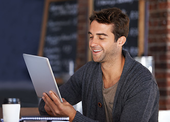 Image showing Tablet, smile and young man in coffee shop doing research for creative freelance project. Happy, digital technology and male designer freelancer reading information on website for career in cafe.
