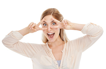 Image showing Excited, peace sign and portrait of woman in studio isolated on a white background. Face, fingers and v hand gesture, emoji and happy young model with funny symbol for victory, success and winning