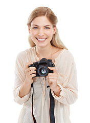 Image showing Portrait, photographer and happy woman with camera in studio isolated on a white background. Face smile, paparazzi and dslr technology for hobby, taking pictures and creative professional photoshoot