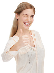 Image showing Portrait, happy woman and wink with thumbs up in studio for support, trust or winning gesture on white background. Face, smile and female model with hand emoji for success, thank you or motivation