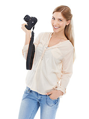 Image showing Portrait, creative photographer and happy woman with camera in studio isolated on a white background. Confident person, paparazzi and technology for hobby, taking pictures or professional photoshoot