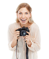 Image showing Portrait, creative photographer and excited woman with camera in studio isolated on a white background. Funny face, paparazzi and technology for hobby, taking pictures and professional photoshoot