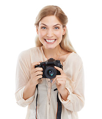Image showing Portrait, photographer and smile of woman with camera in studio isolated on a white background. Happy face, paparazzi and dslr technology for hobby, take pictures and creative professional photoshoot