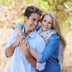 Image showing Couple, portrait and happy or hug with travel in forest, nature or outdoor for holiday, vacation or trip. Romance, man and woman with embrace or smile for relationship, date or honeymoon with love