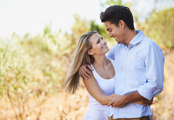 Image showing Happy couple, hug and embrace in nature for bonding, love support for outdoor affection or comfort. Face of young woman and man hugging for embrace or peaceful romance in forest or woods together