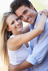 Image showing Happy, young couple and portrait with hug in nature, bonding together and love in marriage with commitment. People, smile and face in embrace on outdoor break, relax and summer vacation for romance