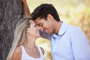 Image showing Happy couple, nature and affection for love, support or embrace in outdoor comfort or bonding. Young woman and man relaxing on tree with smile for intimacy or romance in forest or woods together