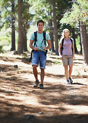 Image showing Couple of friends, travel and hiking in forest for fitness, outdoor adventure and wellness or health in nature. Portrait of happy man and woman walking and trekking with backpack on path and journey