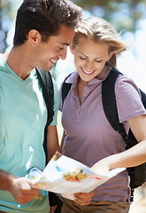 Image showing Couple, hiking in forest and lost with map, documents guide or location information for nature travel or journey. Young woman and man trekking and planning or search paper for direction in the woods