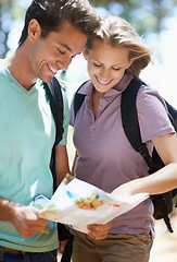 Image showing Couple, hiking in nature and lost with map, documents guide or location information of forest travel or journey. Young woman and man trekking and planning or search paper for direction in the woods