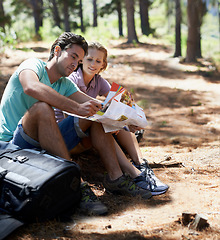 Image showing Couple, travel in forest and reading map for direction, documents guide or location information on a journey. Lost people on a break with infographics, brochure of nature and destination for trekking