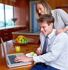 Image showing Couple, laptop and home with breakfast, online information and social network scroll with a smile. Marriage, computer and tech with web research, support and love together on the internet in a house