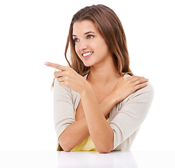 Image showing Deal, happy woman or pointing to offer, announcement or advertising space on white background. Smile, studio or model with presentation for marketing of promotion, sale information or ads commercial