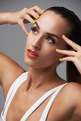 Image showing Face, beauty and thinking with manicure woman in studio isolated on gray background for cosmetology. Makeup, lipstick and cosmetics with confident young model closeup for luxury or colorful nails