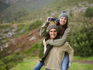 Image showing Hiking portrait, binocular or happy couple on piggyback ride, have fun and enjoy mountain climbing journey in nature. Marriage, love or people bond on travel adventure, trekking or bird watching trip