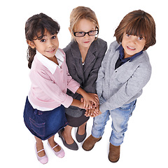 Image showing Portrait, children or business with hands together, group or kids isolated on white studio background. Models, top view or circle with teamwork or cooperation with dress up or clothes with confidence