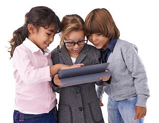 Image showing Children, business and kids with a tablet, typing and connection isolated on white studio background. Group, technology or digital app with social media and internet with website information and talk