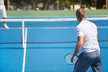 Image showing Sport, man and tennis on court with workout, competition and performance outdoor with fitness and energy. Athlete, player and ball on turf for training, exercise and racket with skill, game and hobby