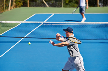 Image showing Athlete, man and tennis on court with workout, competition and performance outdoor with fitness and energy. Sport, player and ball on turf for training, exercise and racket with serve, game and hobby