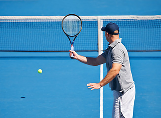 Image showing Fitness, man and tennis on court with serve, competition and performance outdoor with sport and energy. Athlete, player and ball on turf for training, exercise and racket with skill, game and hobby