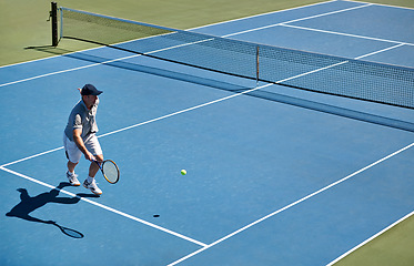 Image showing Sport, man and tennis on court with fitness, competition and performance outdoor with match and energy. Power, athlete and ball on turf for training, health and racket with skill, game or hobby