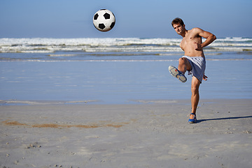 Image showing Man, beach and soccer ball in fitness, exercise or outdoor hobby for surfing or practice. Young male person or sports player kicking on ocean coast for football game, match or friendly by the seaside