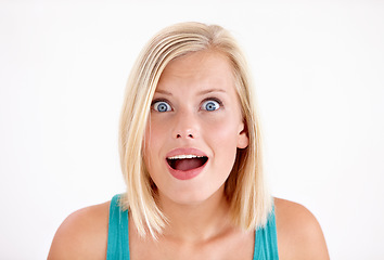 Image showing Wow, shock and surprise, portrait of woman with fake news or announcement of discount sale in studio. Person with confused face, emoji or meme for gossip drama with girl isolated on white background.