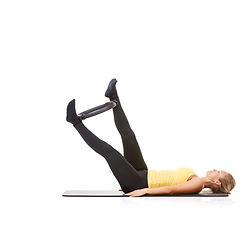 Image showing Pilates ring, legs and woman exercise in studio isolated on a white background mockup space. Training, person on mat and magic circle for feet, balance and fitness for healthy body workout on floor