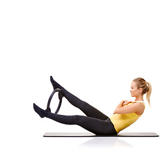 Image showing Woman, pilates ring and legs for balance exercise for resistance training, strong core or studio white background. Female person, equipment for thigh muscle wellbeing or abs workout, health or mockup
