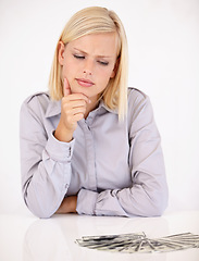 Image showing Thinking, woman and money with decision, investment and savings for budget and reward. Wealth, finance and wondering person with choice and cash profit from work bonus in studio with white background