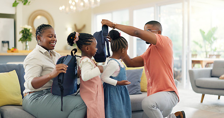 Image showing Morning, talking and a black family ready for school, preparation and helping with bags. Happy, care and children with help from an African mother and father for kindergarten in a home living room