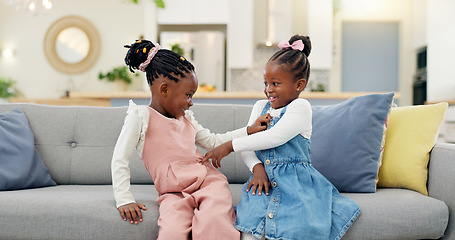 Image showing Kids, play and couch in a home with poke, smile and happy from sibling bonding together. House, lounge sofa and daughter friends with game and girl friendship with fun and youth in a living room