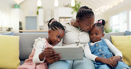 Image showing Happy, mother with her child and tablet on sofa in living room of their home together. Technology or connectivity, happiness or kissing and black family on couch streaming a movie in their house