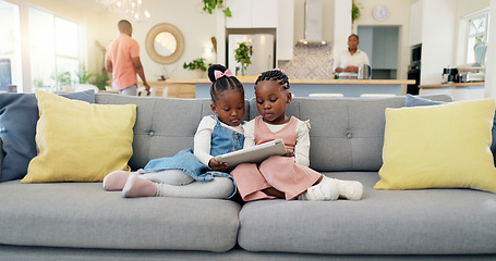 Image showing Black girl children, relax with tablet on sofa and elearning or watching cartoon movie, sisters at home and screen time. Young female kids, streaming online and subscription to education app or film