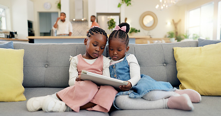 Image showing Black girl children, relax with tablet on sofa and elearning or watching cartoon movie, sisters at home and screen time. Young female kids, streaming online and subscription to education app or film