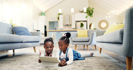 Image showing Black girl children on ground with tablet and relax, elearning or watch cartoon movie, sisters at home and screen time. Young female kids, streaming online and subscription to education app or film