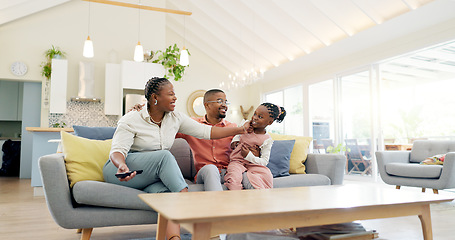 Image showing Support, black family on sofa and in living room of their home happy together smiling. Support or care, happiness or bonding time and African people cuddle on couch in their house for positivity