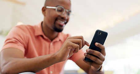 Image showing Hands, typing and a black man with a phone on the sofa for social media, connection or communication. Smile, relax and an African person with a mobile for an app, email or notification in a house