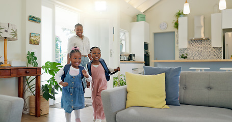 Image showing Father, family hug and student after school with love and support in a home feeling happy. House, living room and dad with children and youth with smile and young kids with papa and parent care