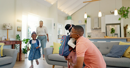 Image showing Father, hug and student after school with love and support in a home feeling happy. House, living room and dad with children and youth with a family and young kids together with papa and parent care