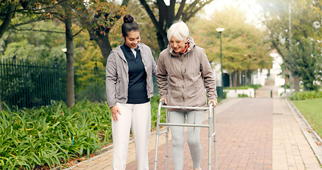 Image showing Senior woman, walker and nurse outdoor in a park with healthcare for elderly exercise. Walking, healthcare professional and female person with peace and physical therapy in a public garden with carer