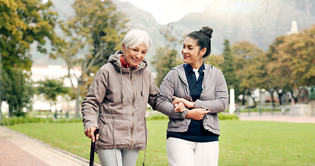 Image showing Senior woman, walker and nurse outdoor in a park with healthcare for elderly exercise. Walking, healthcare professional and female person with peace and physical therapy in a public garden with carer