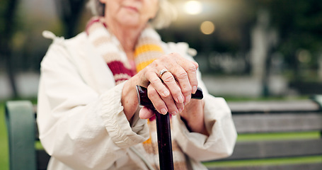 Image showing Walking stick, hands and senior woman closeup on a park bench with person with disability. Mobility support, wellness and balance with cane and elderly female person outdoor in a public garden