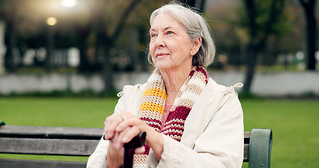 Image showing Relax, thinking and a senior woman at the park for summer, ideas or retirement vision. Smile, remember and an elderly person on a bench in nature with inspiration, memory or outdoor reflection