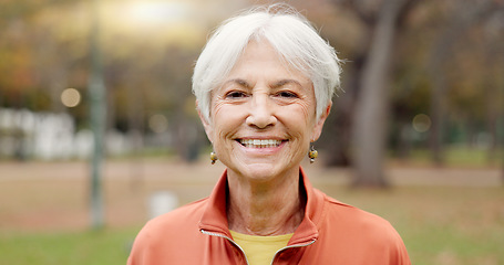 Image showing Senior woman with a smile, portrait in the park and happiness in nature, woods or outdoor for a walk in retirement. Happy, face and elderly person with wellness from exercise or healthy workout