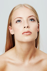 Image showing Woman, face and thinking for beauty and natural skincare in studio, headshot for wellness and dermatology on white background. Ideas, inspiration and thoughtful model, clean makeup and cosmetics